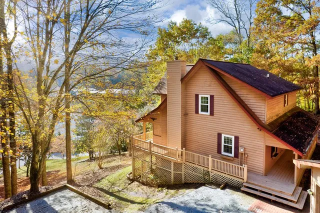 a backyard of a house with lots of trees