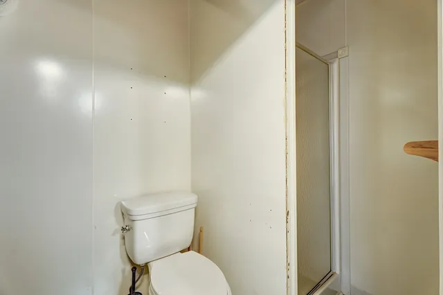 a view of a brick house with a large window