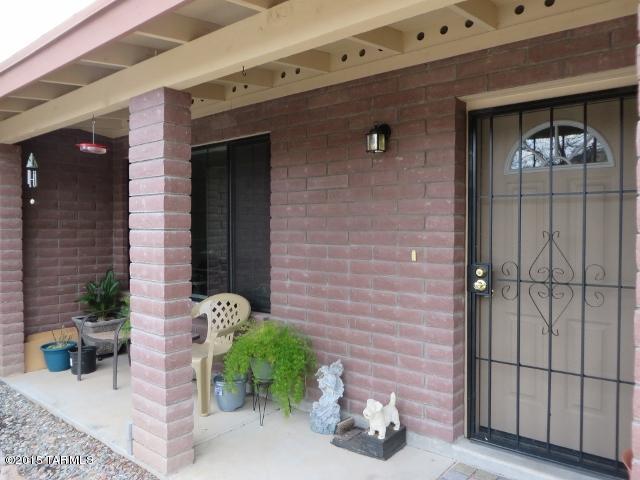 963 Calle Amarillo Rio Rico, AZ 85648 - Photo 11 of 31 a couple of potted plants in front of door