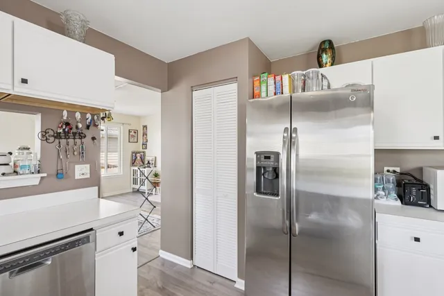 a kitchen with a refrigerator and a sink
