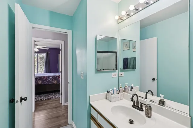 a en suite bathroom with a sink and a mirror