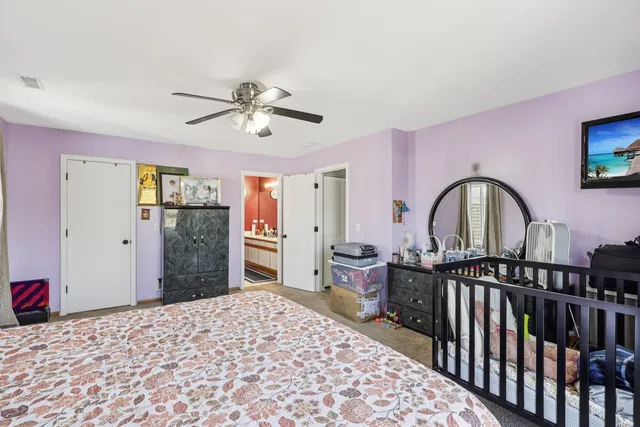 a bedroom with furniture and window