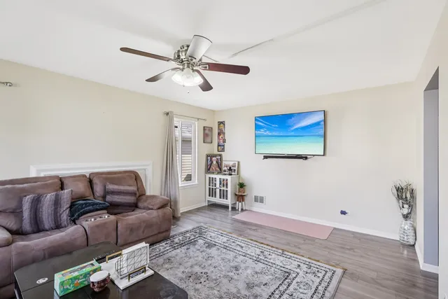 a living room with furniture and a rug
