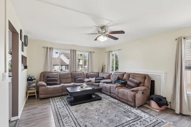 a living room with furniture and a rug