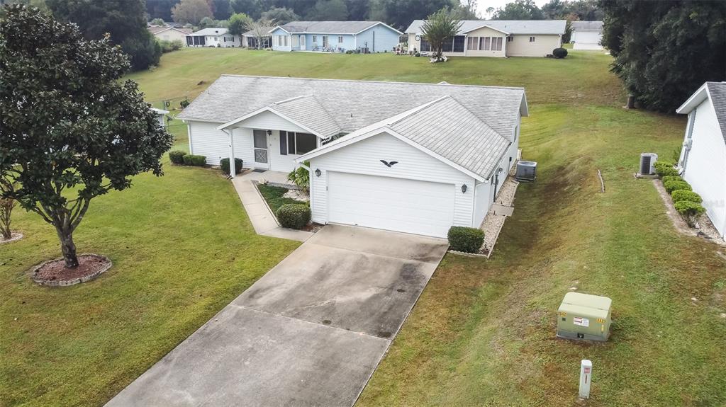 8140 Southwest 106th Place Ocala, FL 34481 - Photo 1 of 1 an aerial view of a house with swimming pool