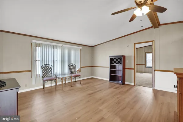 a view of livingroom with furniture wooden floor and window