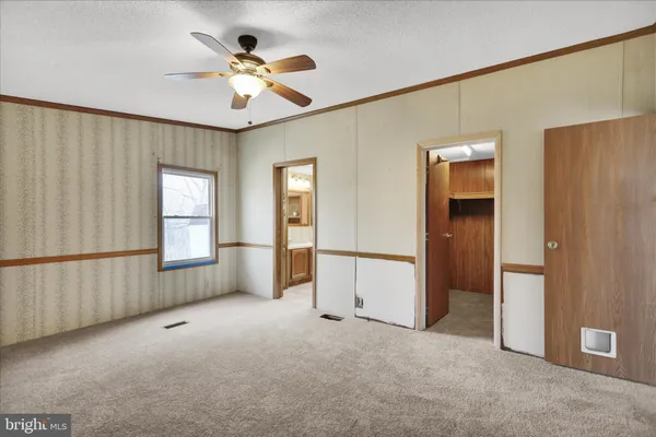a view of an empty room with a window