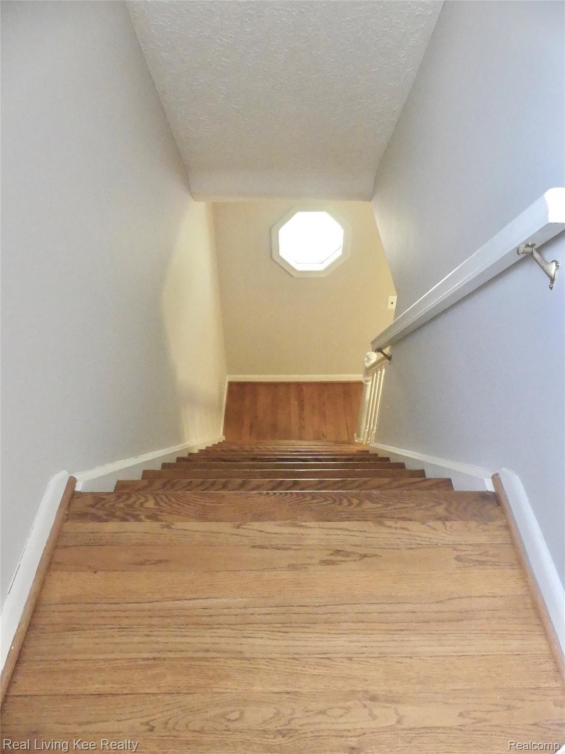 67 Cedarwald Drive Rochester, MI 48306 - Photo 40 of 49 Stairway from foyer to upper level