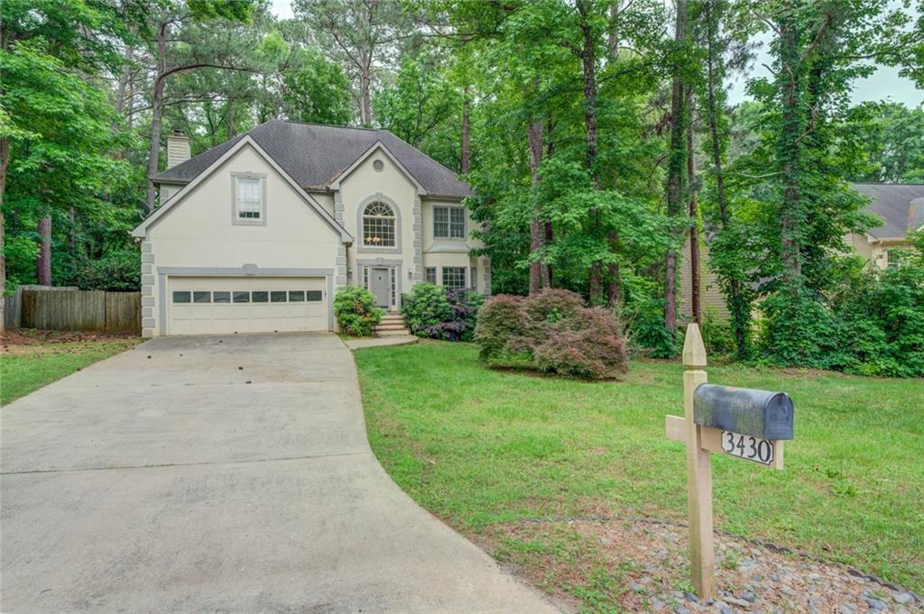 a view of front of house with a yard