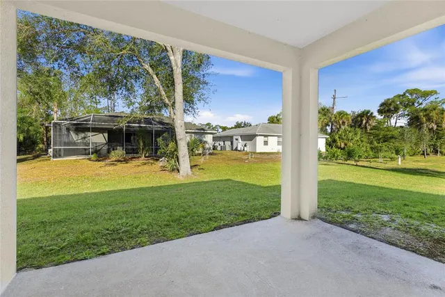 a view of a house with a yard porch and sitting area