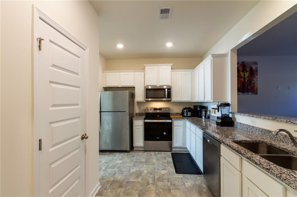 4282 Callum Court Decatur, GA 30034 - Photo 13 of 30 a kitchen with a refrigerator stove and sink