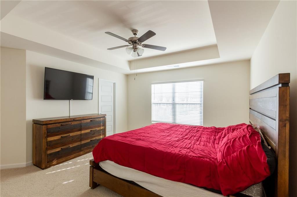 4282 Callum Court Decatur, GA 30034 - Photo 15 of 30 a bedroom with a bed and a flat screen tv