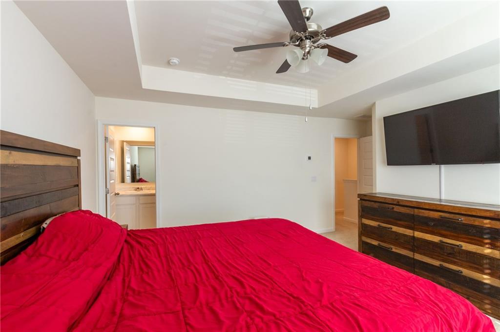 4282 Callum Court Decatur, GA 30034 - Photo 16 of 30 a bedroom with a bed and a flat screen tv