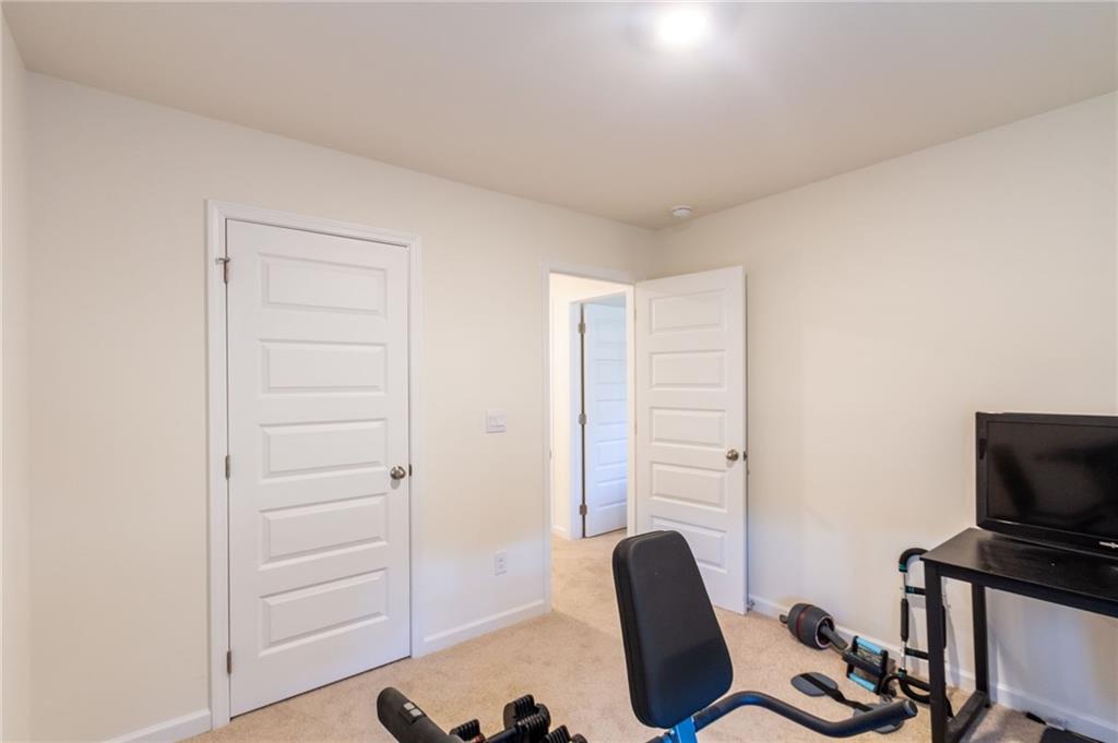 4282 Callum Court Decatur, GA 30034 - Photo 20 of 30 a view of a workspace with furniture and wooden floor