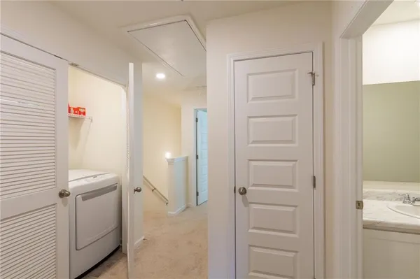 a bathroom with a shower and a sink