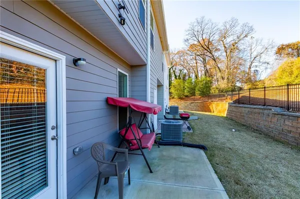 a view from deck with patio
