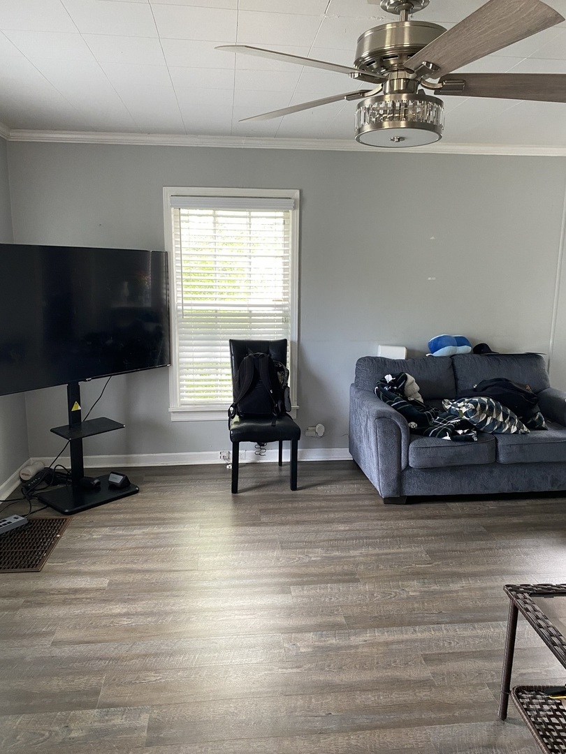 14735 Myrtle Avenue Harvey, IL 60426 - Photo 3 of 6 a living room with furniture and a flat screen tv