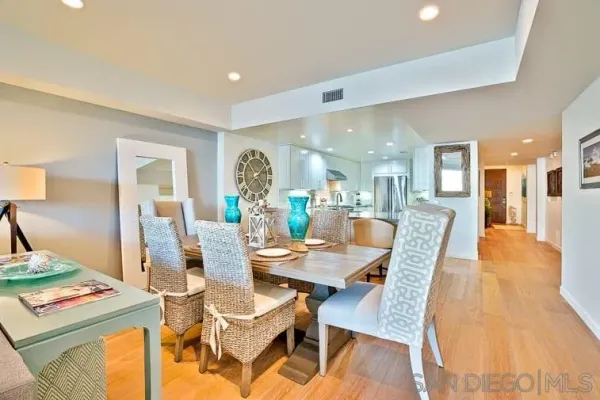 a dining room with a table and chairs