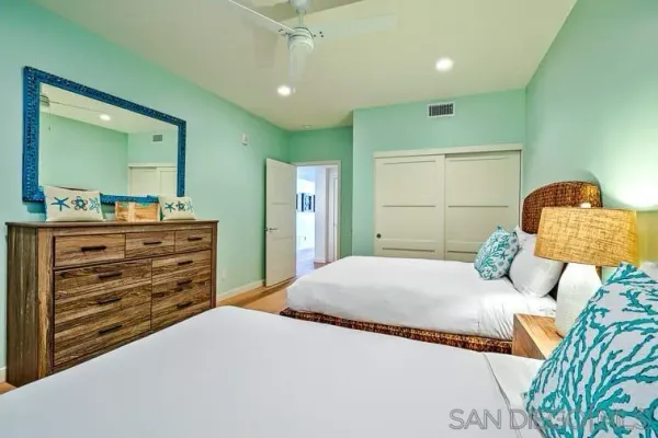 a bedroom with a bed and a dresser