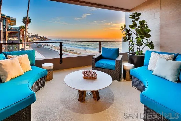 6767 Neptune Place, Unit 202 La Jolla, CA 92037 - Photo 2 of 27 a living room with furniture and a lamp
