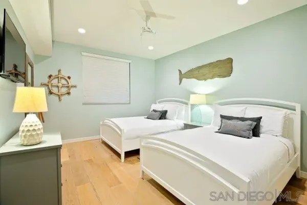 a bedroom with a bed and a lamp