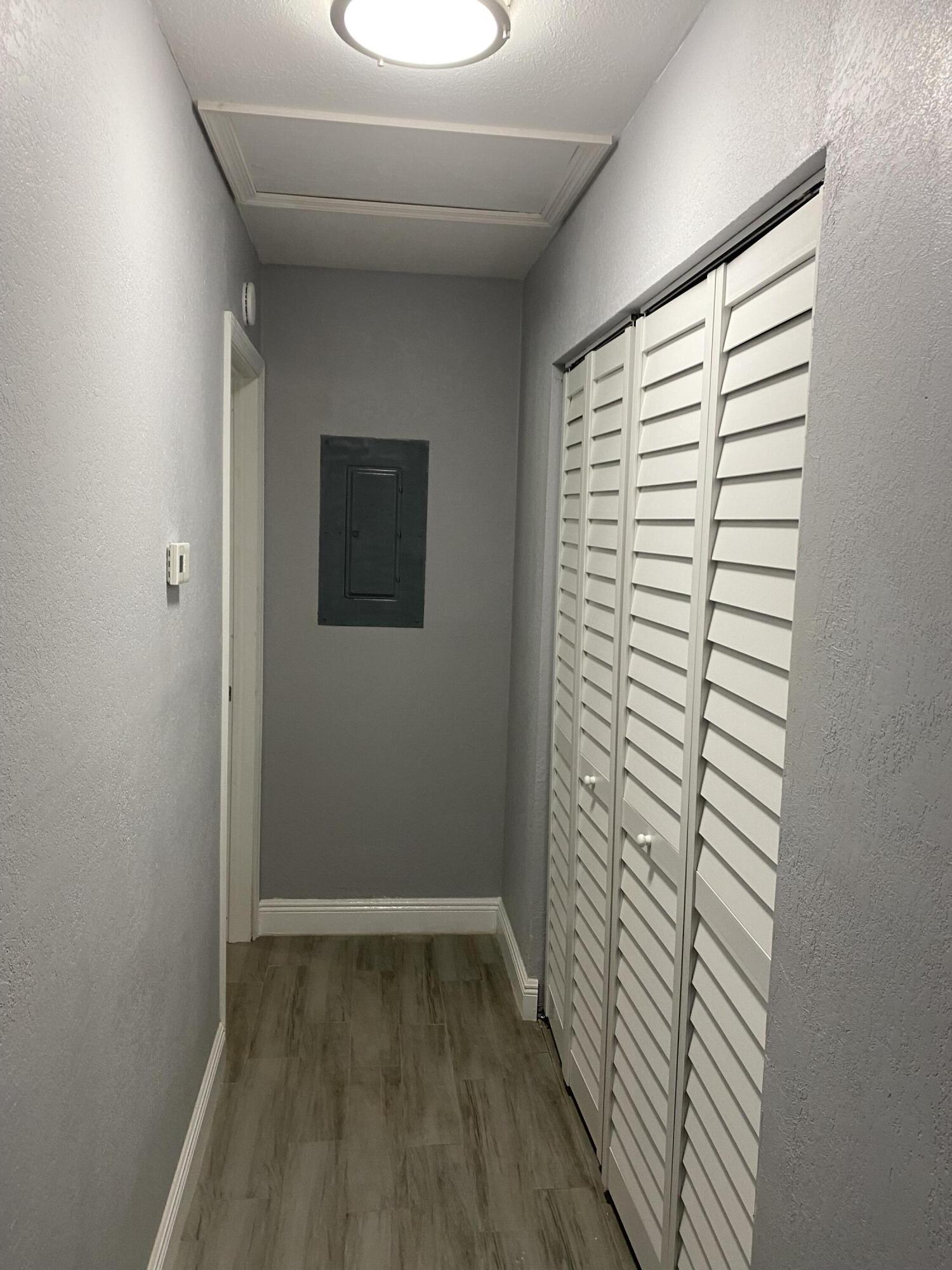 232 Northwest 9th Street Pompano Beach, FL 33060 - Photo 20 of 46 a view of hallway with window and wooden floor