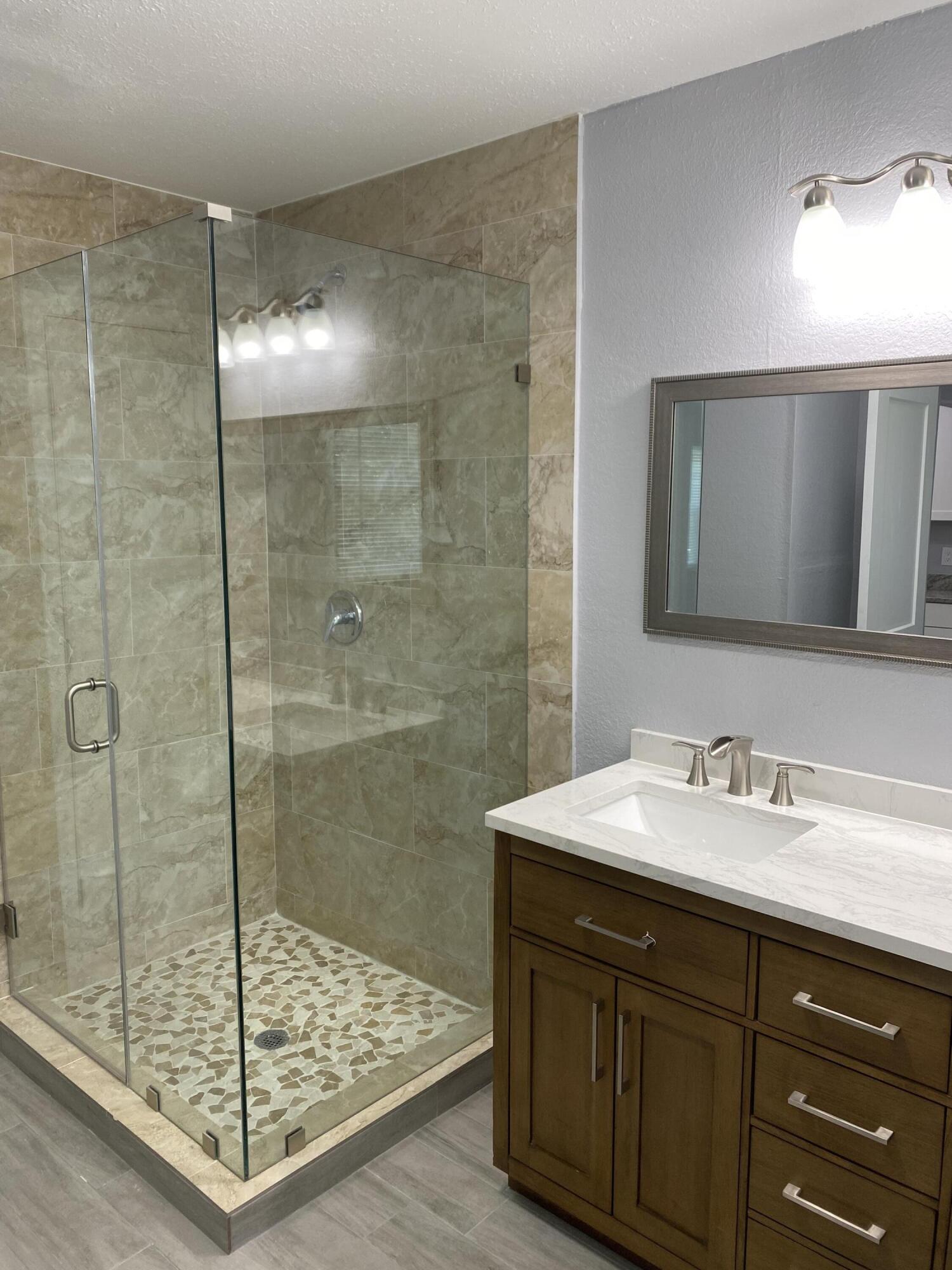 232 Northwest 9th Street Pompano Beach, FL 33060 - Photo 26 of 46 a bathroom with a sink and a mirror
