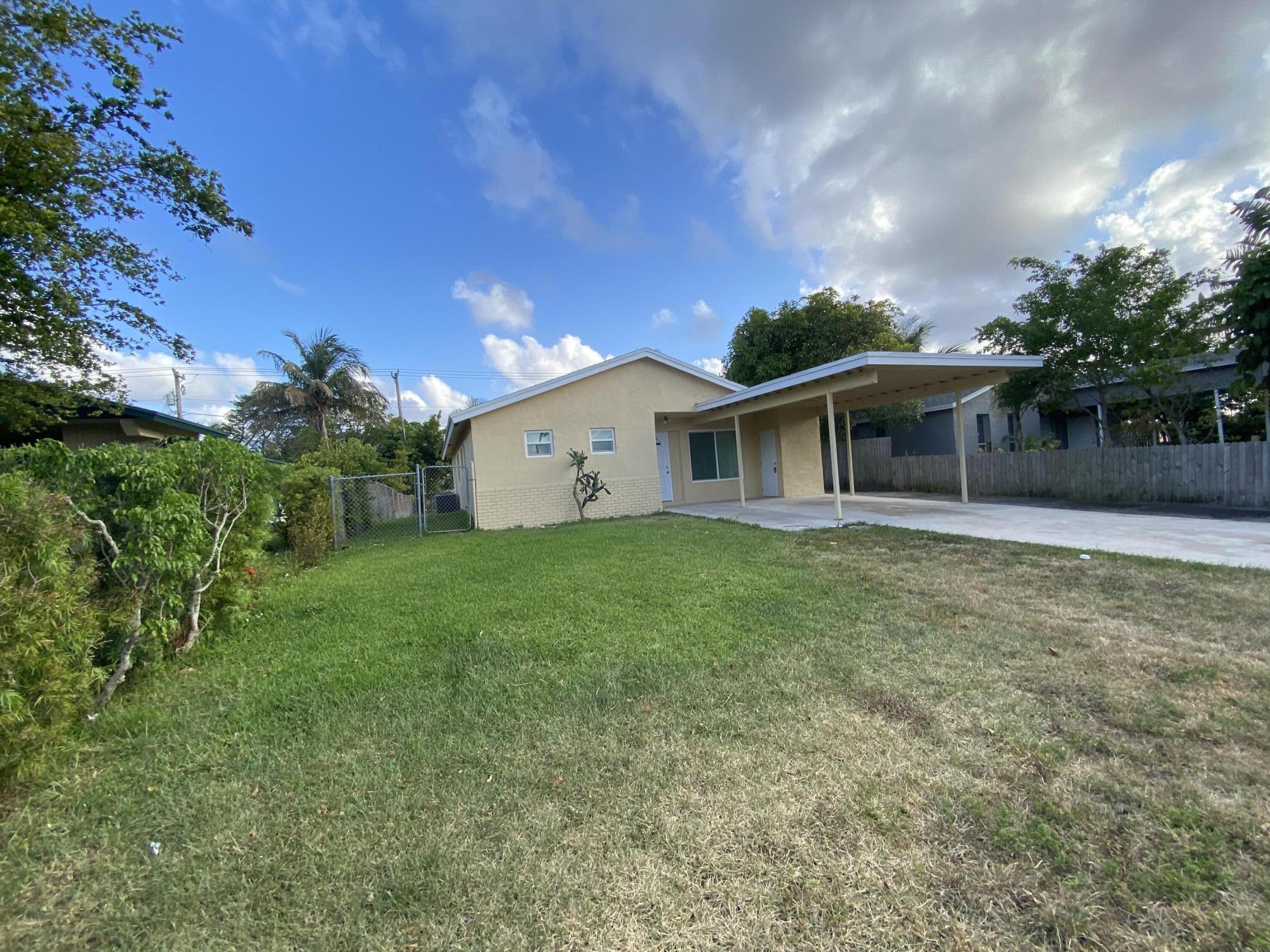 232 Northwest 9th Street Pompano Beach, FL 33060 - Photo 3 of 46 a view of a house with a backyard