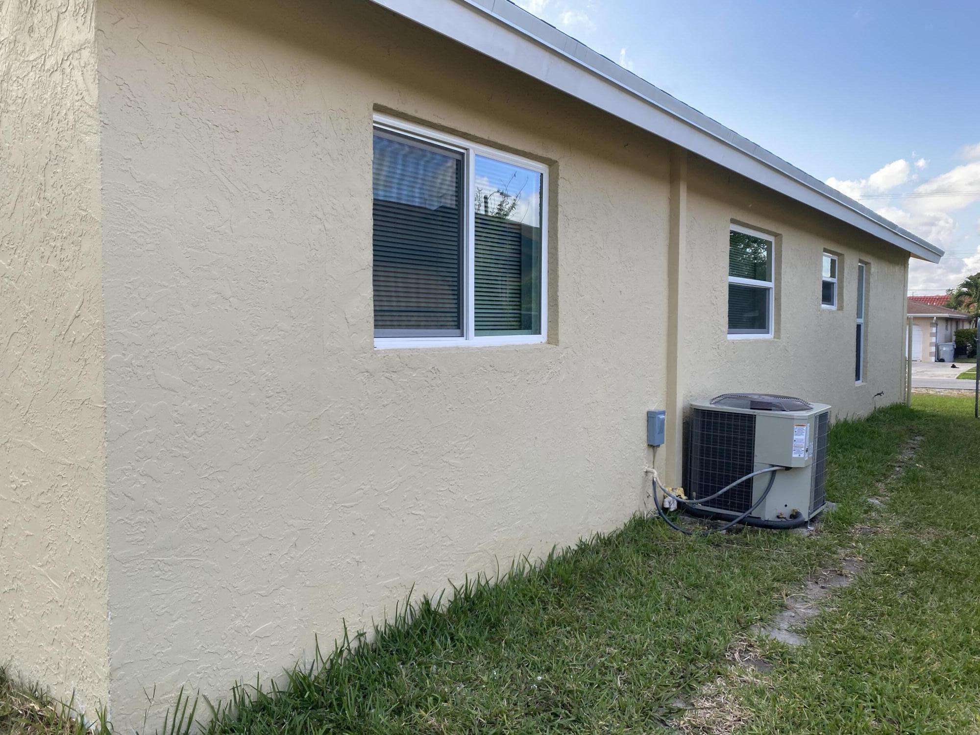 232 Northwest 9th Street Pompano Beach, FL 33060 - Photo 8 of 46 a view of an house with backyard space and garden