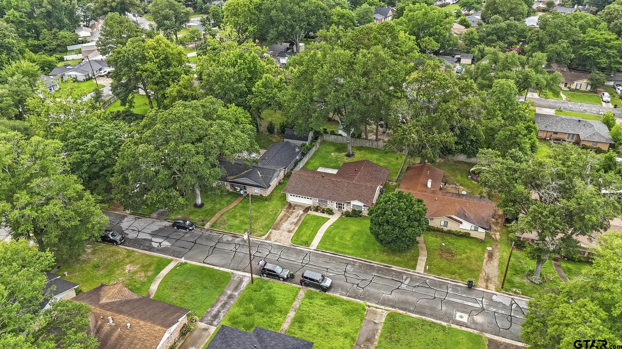 2742 Lisa Lane Tyler, TX 75701 - Photo 2 of 32 an aerial view of a house with a yard