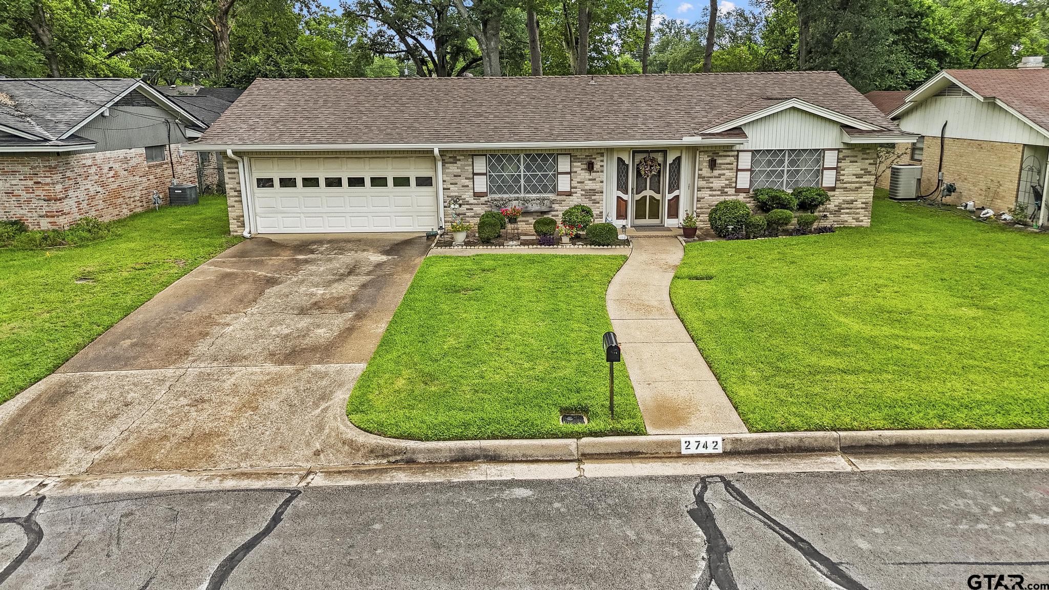 2742 Lisa Lane Tyler, TX 75701 - Photo 25 of 32 a view of a back yard of the house