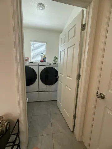 a kitchen with a refrigerator and a stove