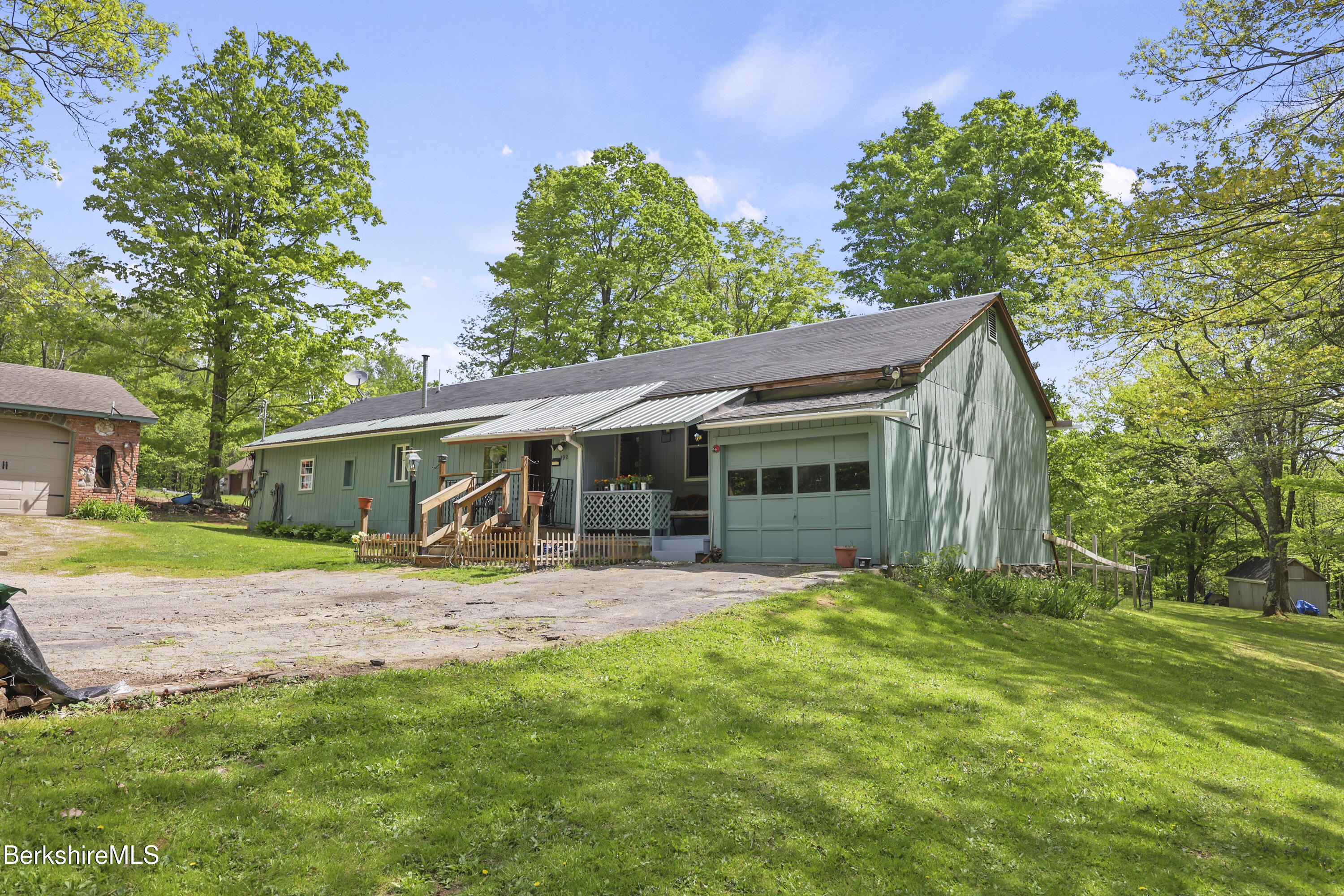 192 Curran Road Cheshire, MA 01225 - Photo 3 of 50 a view of a house with a yard and sitting area