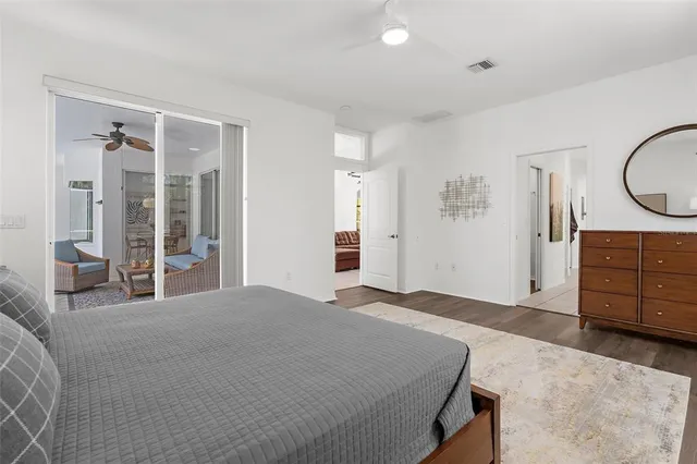 a spacious bathroom with a double vanity sink a mirror and a bathtub