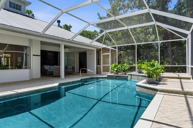 a view of a room with furniture and wooden floor