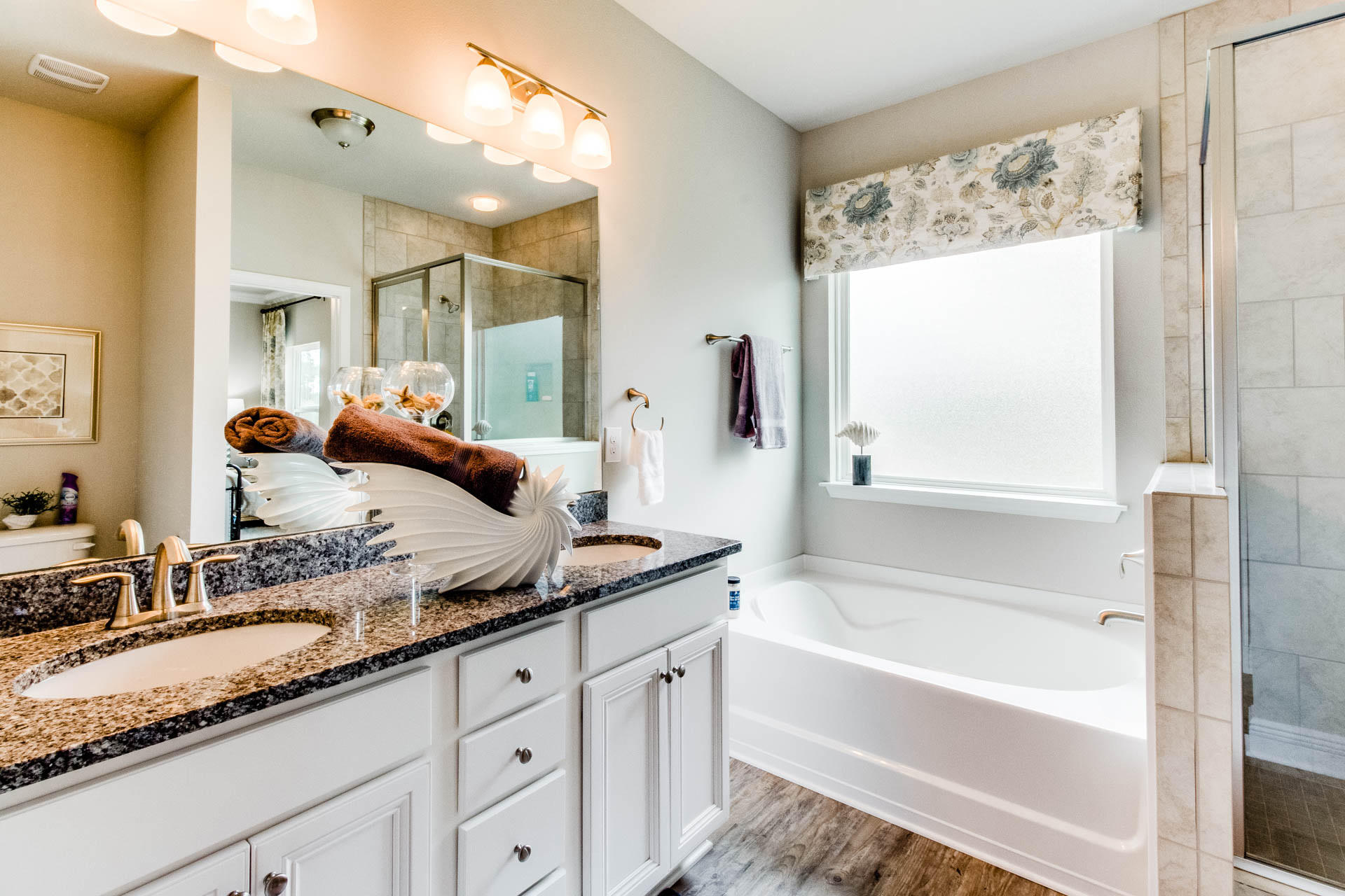 219 Southern Pnes Road Santa Rosa Beach, FL 32459 - Photo 16 of 28 a bathroom with a granite countertop tub sink and mirror