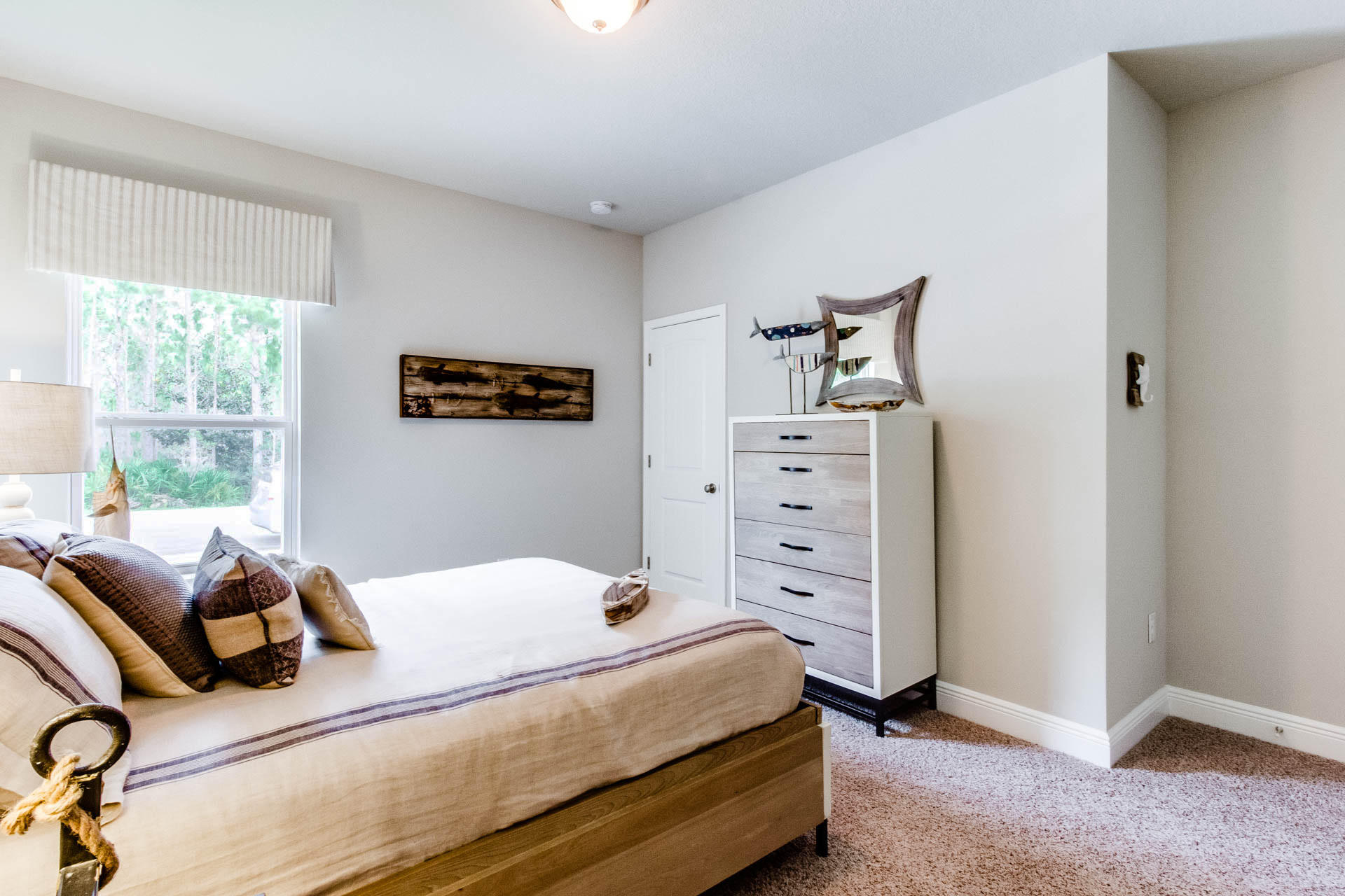 219 Southern Pnes Road Santa Rosa Beach, FL 32459 - Photo 20 of 28 a bedroom with a bed and a dresser