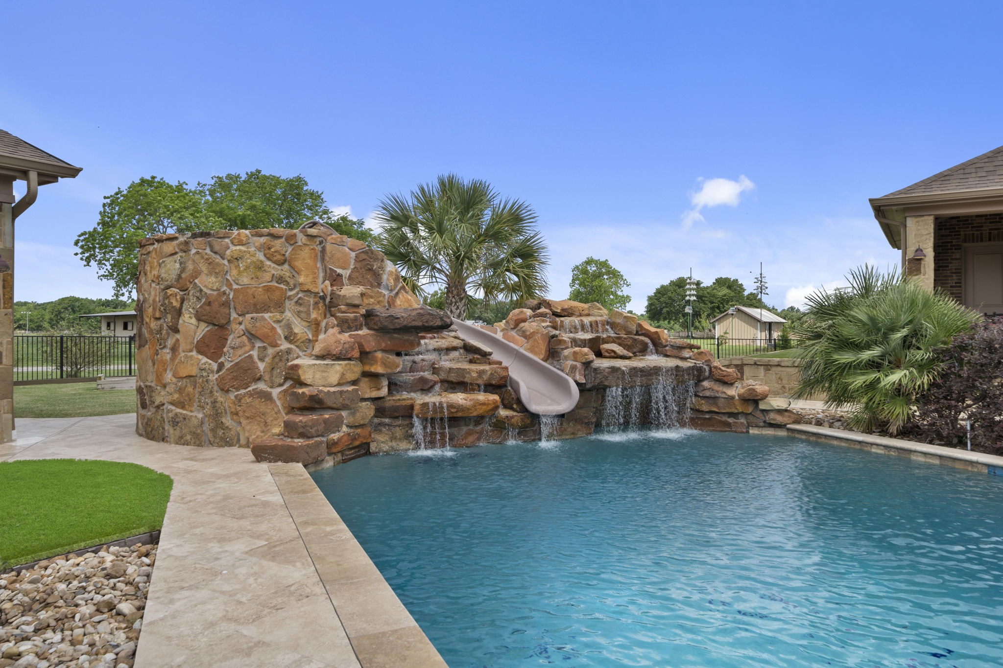 21620 Schiel Road Cypress, TX 77433 - Photo 42 of 49 The rock slide in the pool