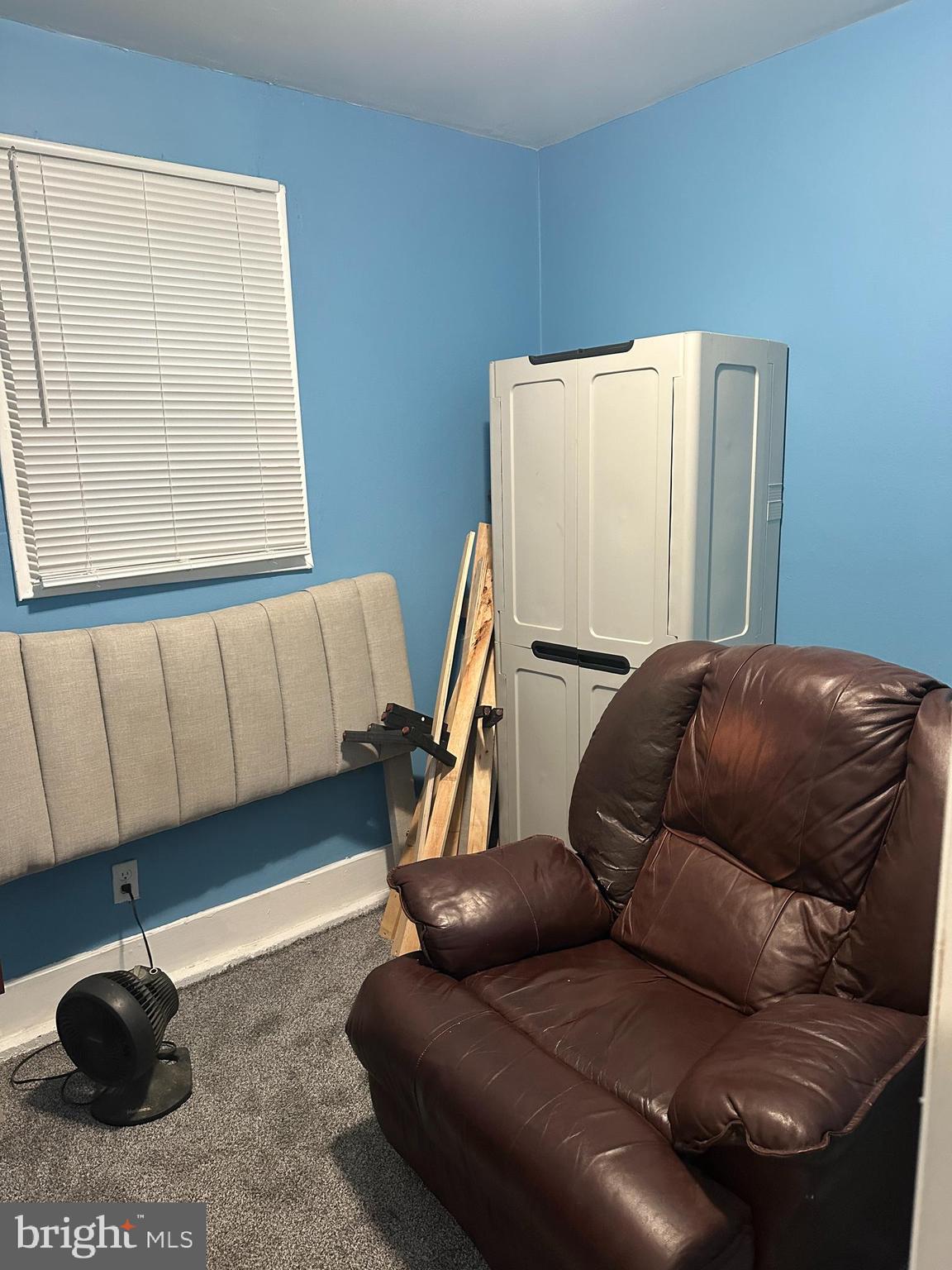 8411 11th Avenue Silver Spring, MD 20903 - Photo 23 of 24 a living room with a couch and a wooden floor