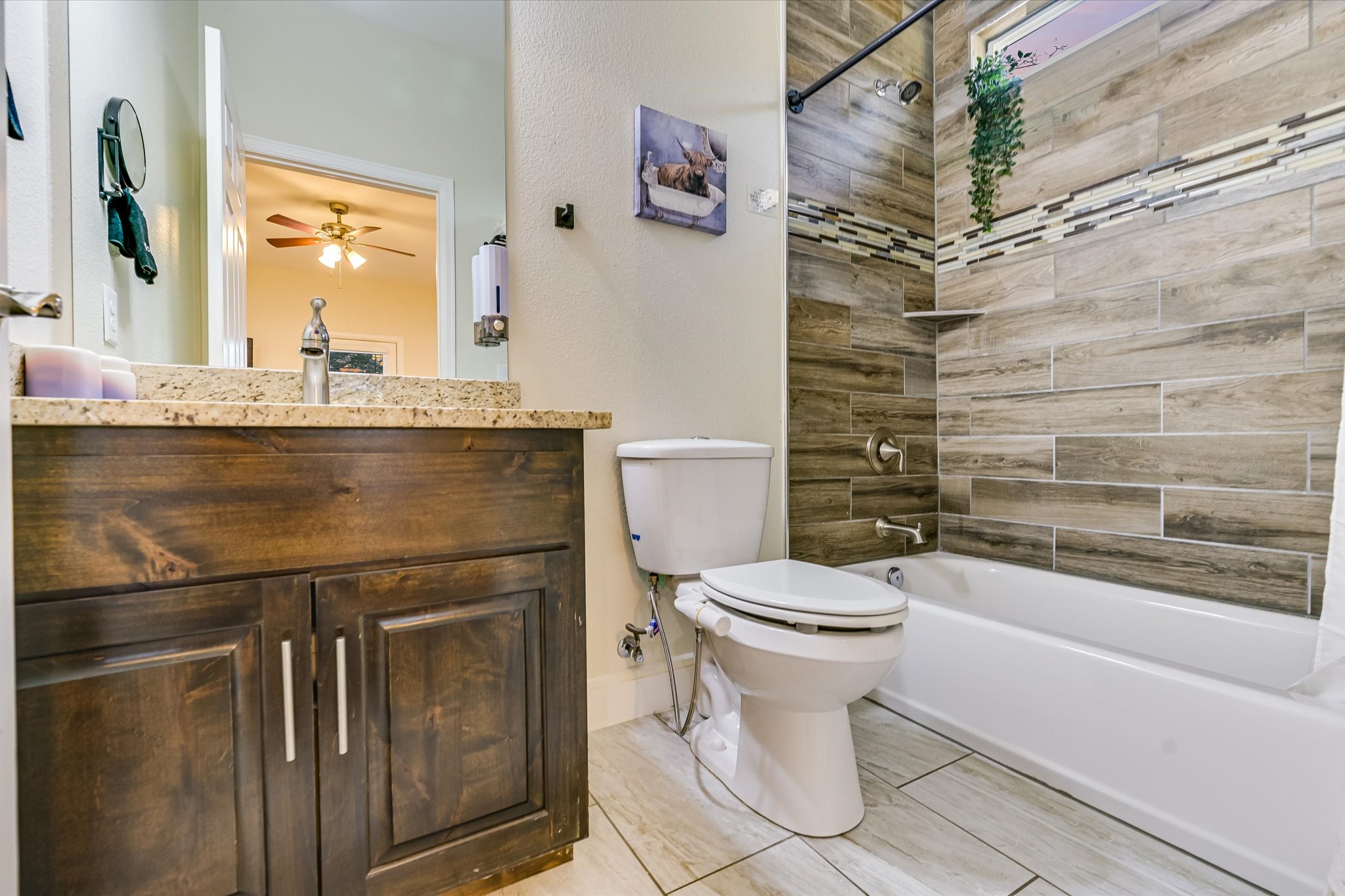 8400 Taylorsville Road Dale, TX 78616 - Photo 15 of 38 Bathroom with vanity, shower / bath combination, and ceiling fan