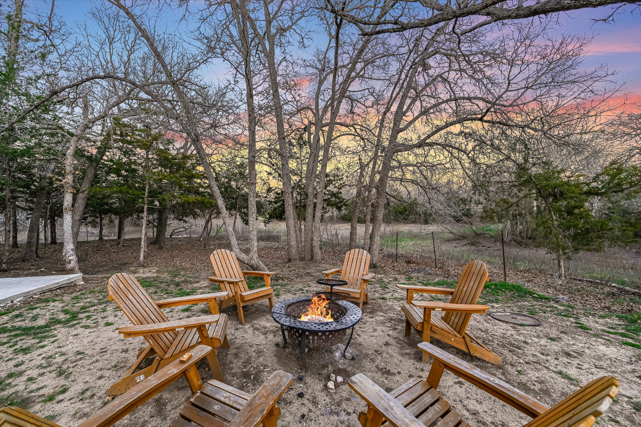 8400 Taylorsville Road Dale, TX 78616 - Photo 26 of 38 Patio terrace at dusk with a fire pit and a patio