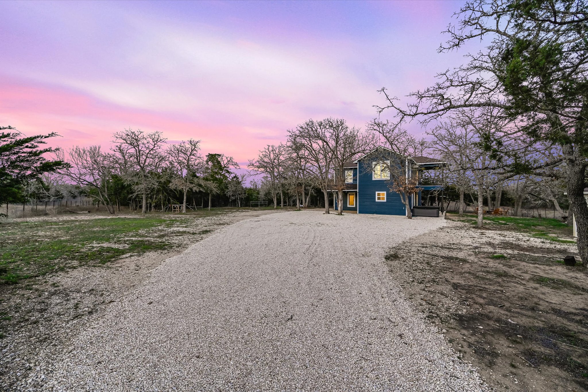 8400 Taylorsville Road Dale, TX 78616 - Photo 3 of 38 View of front of property featuring gravel driveway and a wooden deck