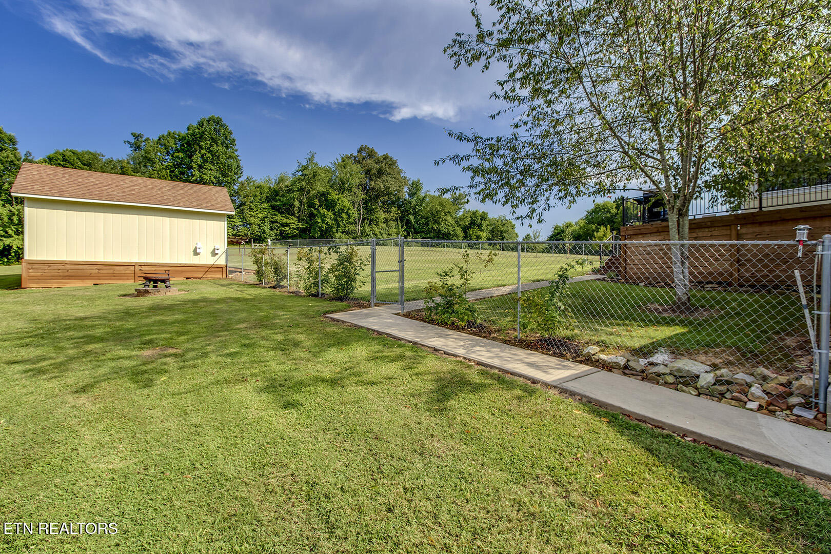 512 Caney Creek Road Harriman, TN 37748 - Photo 46 of 60 46_CaneyCreekRoad_512_FencedBackyardEntr
