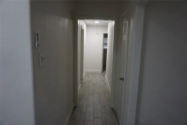 a view of a bathroom from a hallway