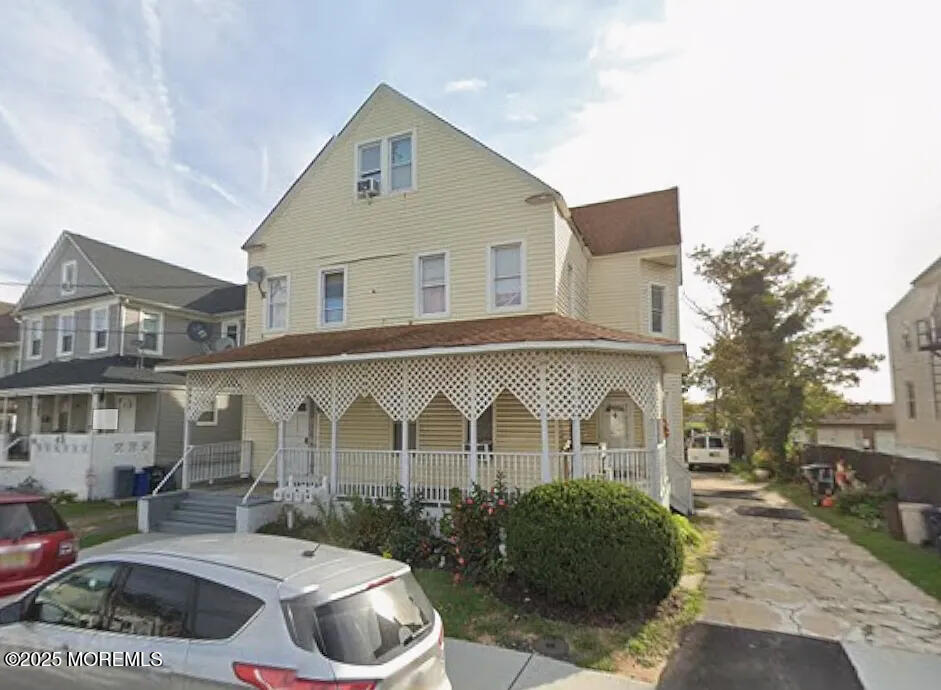49 2nd Avenue, Unit 3 Long Branch, NJ 07740 - Photo 11 of 11 a front view of a house with garden