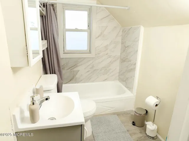 a bathroom with a sink and a bathtub