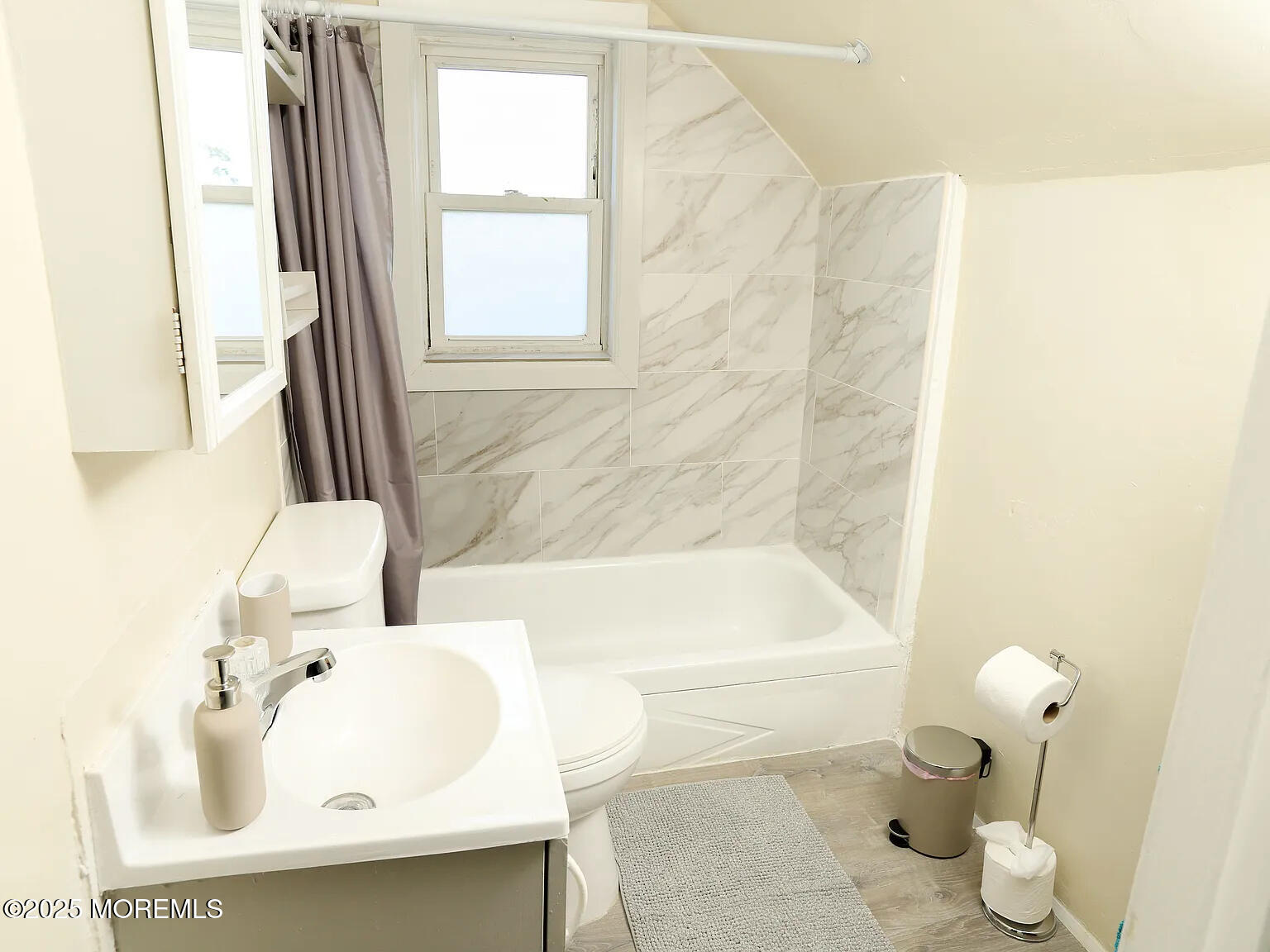 49 2nd Avenue, Unit 3 Long Branch, NJ 07740 - Photo 10 of 11 a bathroom with a sink and a bathtub