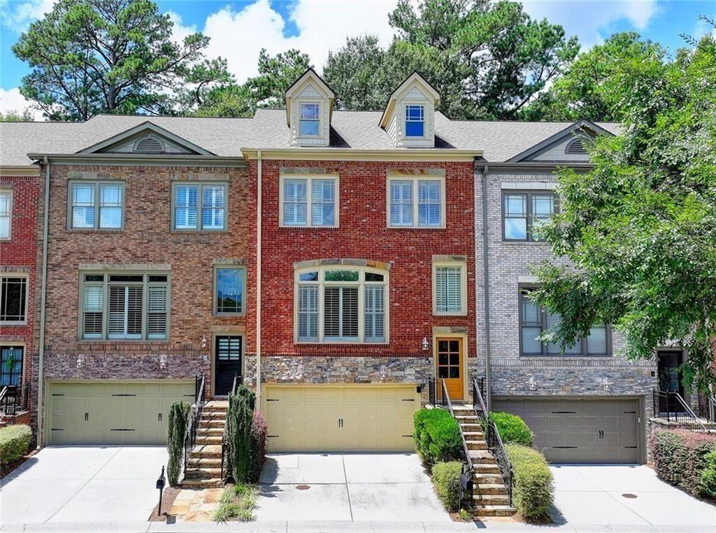 350 Mystic Ridge Lane Atlanta, GA 30342 - Photo 1 of 1 front view of a house with a yard