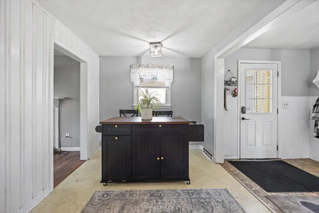 a bathroom with a sink and a shower curtain