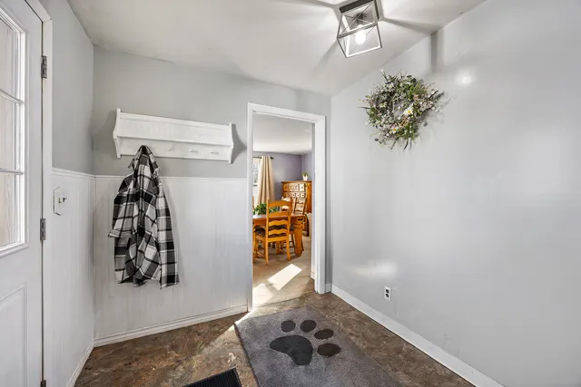 a dining room with furniture and window